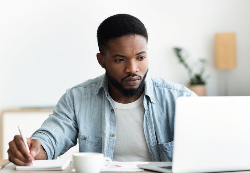 man sending emails, searching for a job